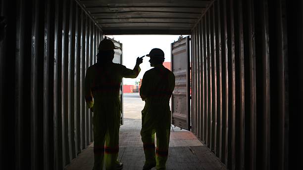 istock Engineers and technicians inspect the inside of containers and order repairs at the container manufacturing and storage site 2202040734