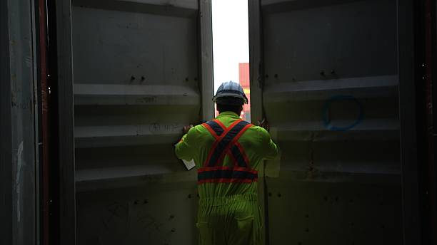 istock Engineers and technicians inspect the inside of containers and order repairs at the container manufacturing and storage site 2202040737