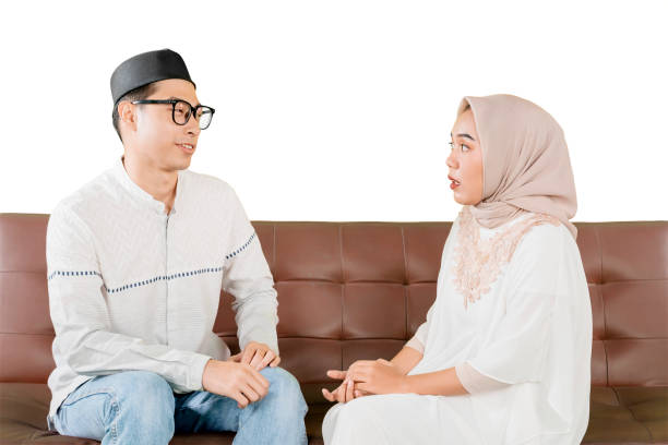 istock Muslim Couple Engaged in a Meaningful Conversation on a Sofa 2202041061