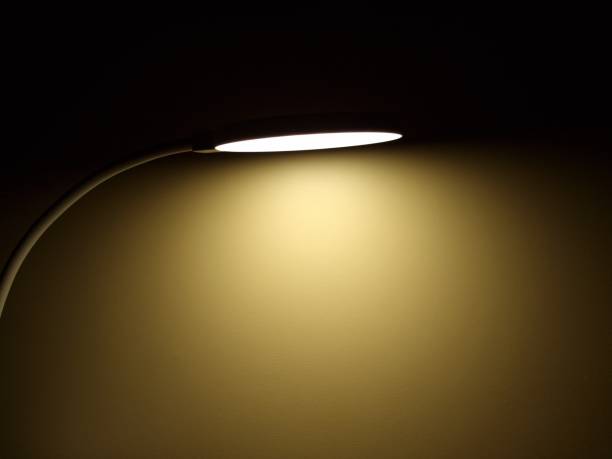 istock Light of a lamp in the darkness. Close up 2202041214