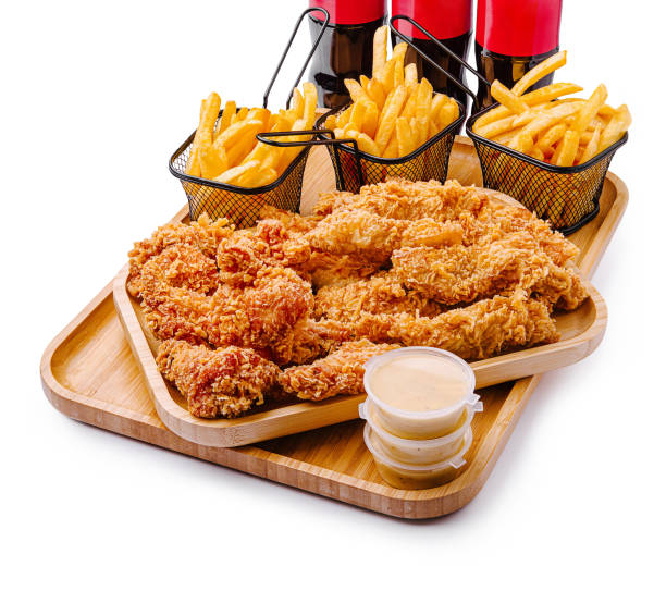 istock Delicious fried chicken with crispy fries and refreshing drinks 2202041373