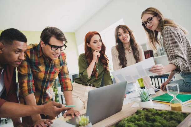 istock Photo of nice young people software developer working together comfortable modern office loft room interior indoors workspace 2202042467