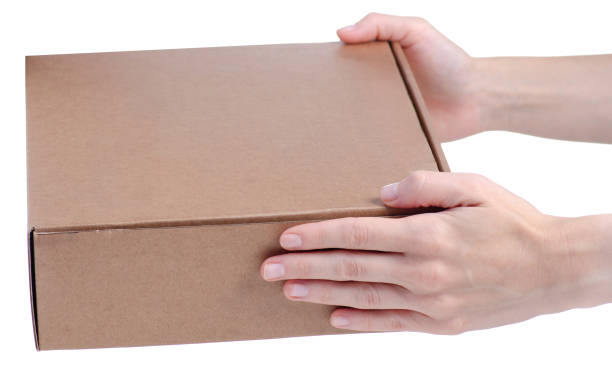 istock Brown carton box in female hand 2202042470