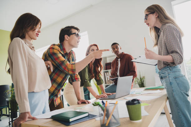 istock Photo of lovely young people blame argument stressed problem startup teambuilding comfortable startup office loft room interior 2202042478
