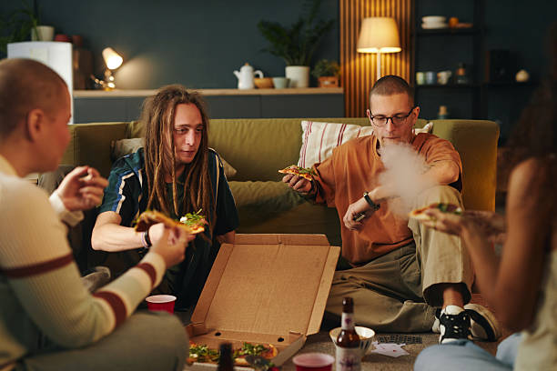 Friends Enjoying Pizza and Hanging Out at Cozy Home