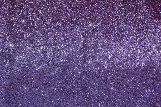 Beautiful elegant shiny purple luxury fabric texture with glitter sequins, shiny lilac background.