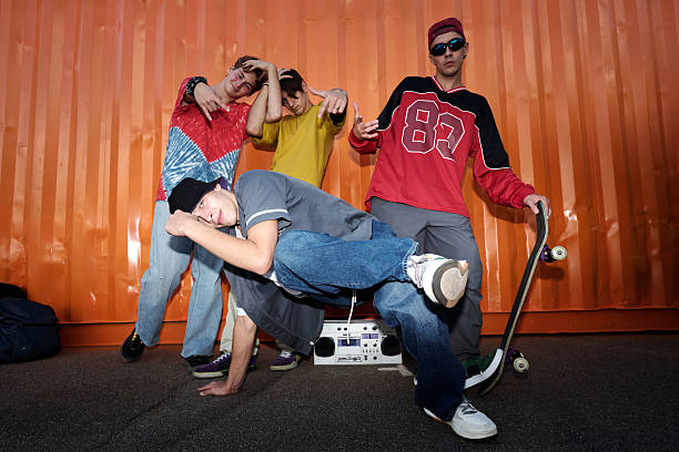 istock Group of Young People Posing Energetically with Skateboard 2202045451