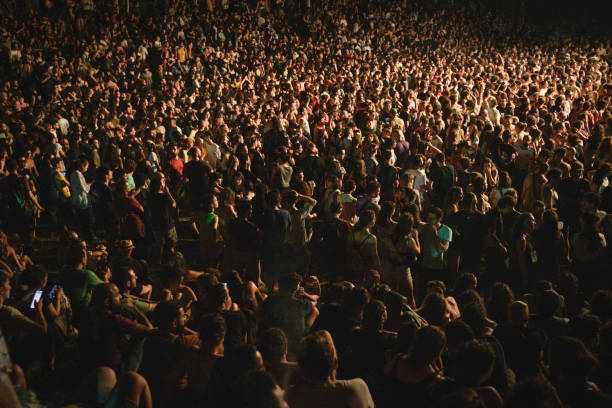 istock Wide-Angle View of Massive Festival Crowd Under Stage Spotlights 2202045531