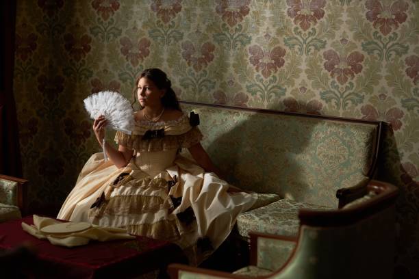 istock Girl Holding Lace Fan 2202045558