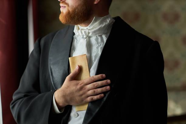 istock Gentleman Holding Letter By Chest 2202045569