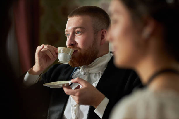 istock Gentleman Holding Porcelain Teacup 2202045596