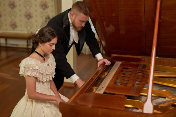 istock Classic Couple Playing Piano 2202045635