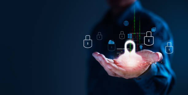 istock Man Holding Hacker Icon Surrounded by Cybersecurity and Cloud Technology Symbols 2202049672