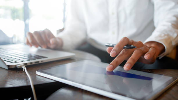 istock close up executive businessman hand check  about summary report annual and quater with interface of chart and graph and statistic on dashboard for business improvement and 4 resolution concept 2202050706