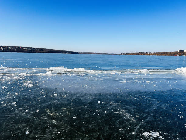 istock Frozen lake surface under a clear blue sky on a winter day 2202052366