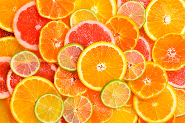 istock Pattern of ripe citrus fruits. Close up. 2202052919