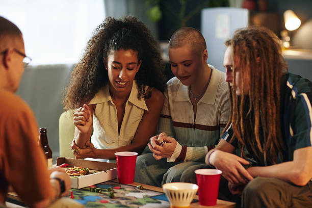 Enjoying Board Game and Pizza Night with Friends