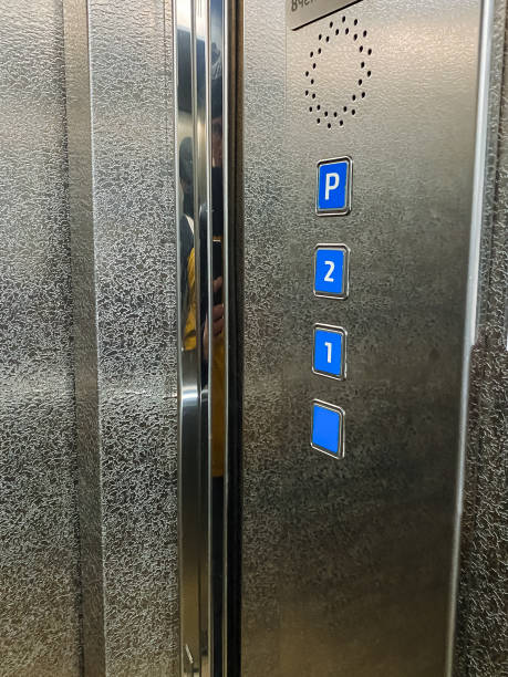 istock This stainless steel elevator features blue buttons labeled for parking P, second floor 2, and entrance level 1, ensuring efficient control of the buildings floors 2202054712
