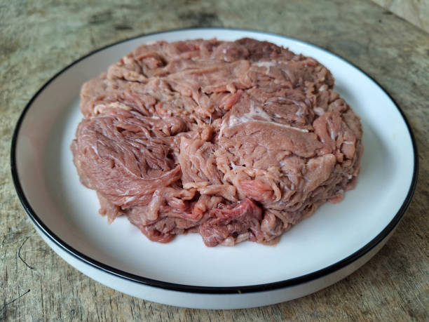 Serving Of Raw Beef Meat On A Plate.