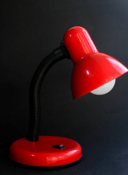 istock there is a red table lamp on a black background 2202061058