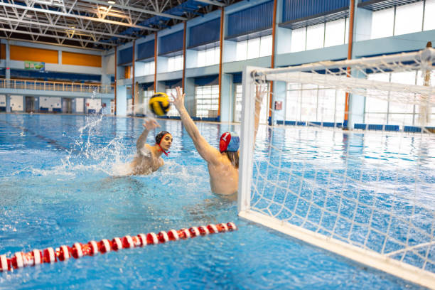 istock Water polo players during a game in the indoor pool 2202061990