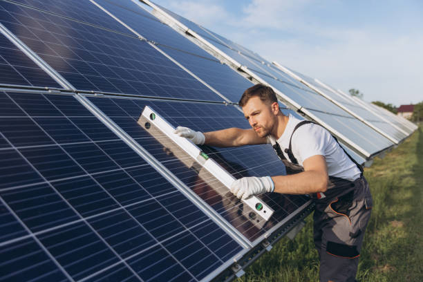 istock Photovoltaic, solar panel and maintenance worker using a building level ruler during inspection. Solar energy, renewable energy and man doing checkup of electricity sustainability innovation 2202063338