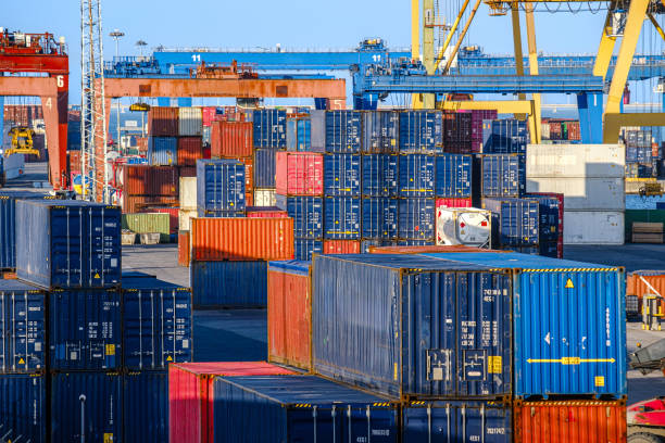 istock Cargo containers stacked at a busy shipping port during daylight 2202066884