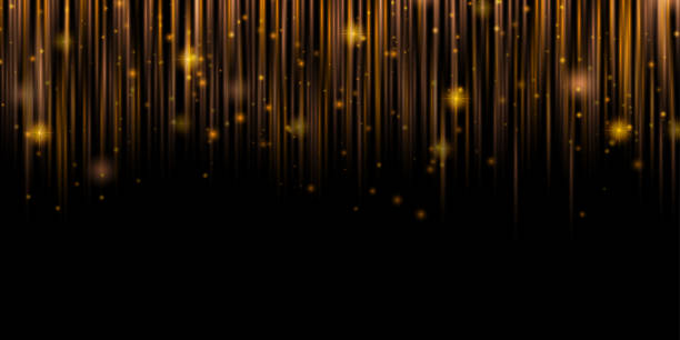 istock Starfall. Shining golden vertical lines of light on a dark background with lighting effect and glitter. Space for text. Luxury design style. 2202066937