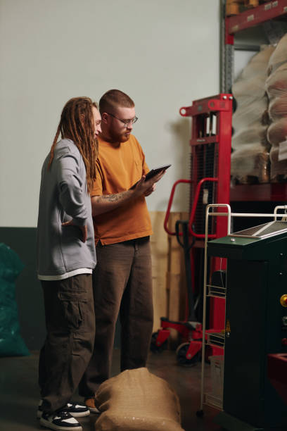 istock Factory Workers Discussing Production of Coffee 2202069262