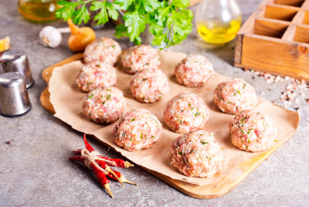 istock Raw meatballs made from ground beef. Top view 2202069600
