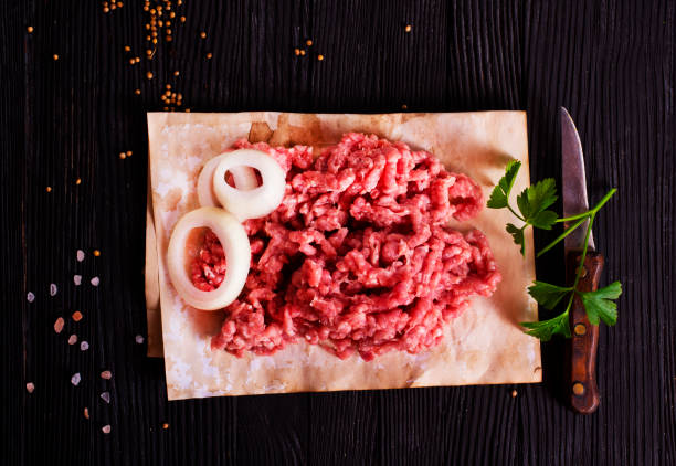 Fresh Raw Beef Minced Meat with salt, pepper, chilli and fresh onion