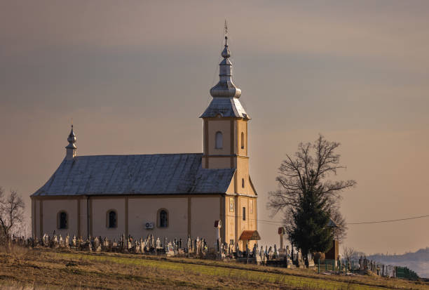 istock Winter landscape with a rural church 2202070825