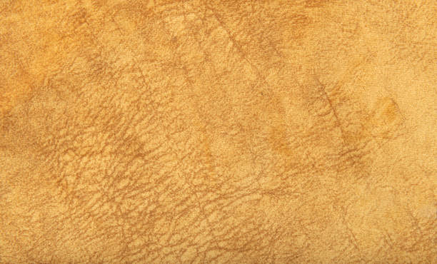 istock Close up high resolution photo of yellow suede leather material texture 2202073062