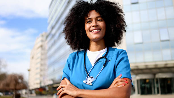 istock Smiling nurse enjoying outside 2202074181
