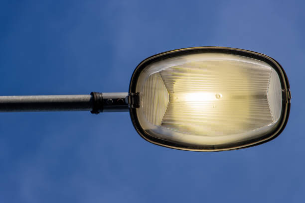 istock The Street lamp shining against blue sky. 2202076574
