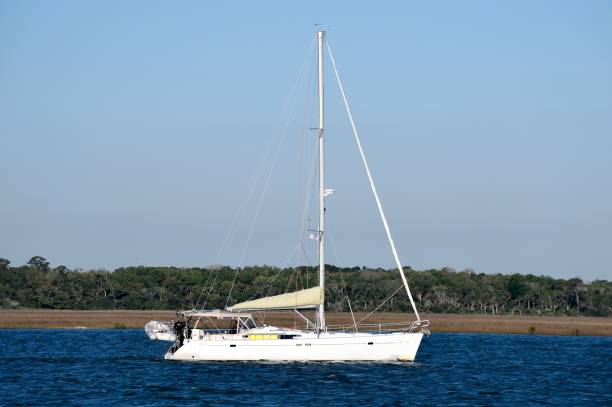 istock Sailboat cruising along the river 2202081269