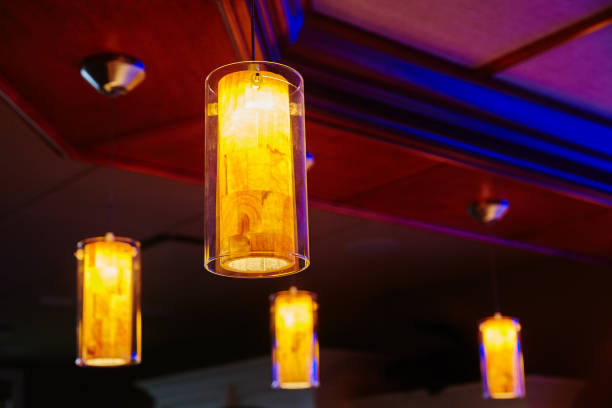 istock Modern Pendant Lighting in Warm Interior, Eye-Level View 2202086567