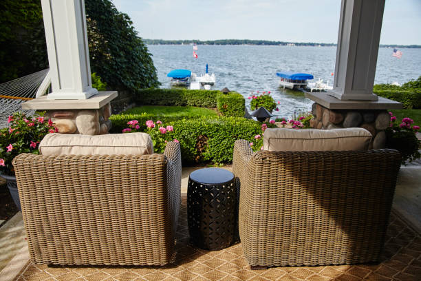 Lakeside Relaxation with Wicker Chairs and American Flag