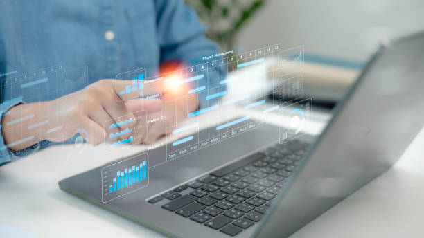 istock Project management concept. Site manager working with Gantt chart schedule to plan tasks and progress. Planning software. Corporate strategy for construction, finance, operations, sales, marketing. 2202089498