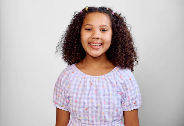 istock Studio portrait of girl wearing gingham blouse, front view 2202091231