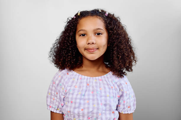 istock Studio portrait of girl wearing gingham blouse 2202091232