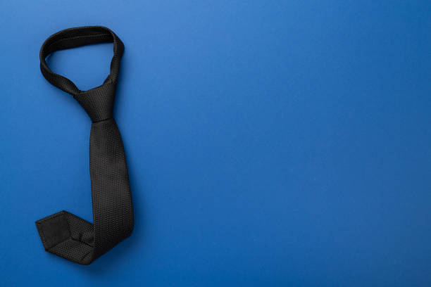 istock Black tie on color background, top view 2202092538