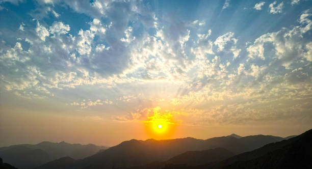 istock Beautiful sunset behind a large rocky mountain range 2202094270