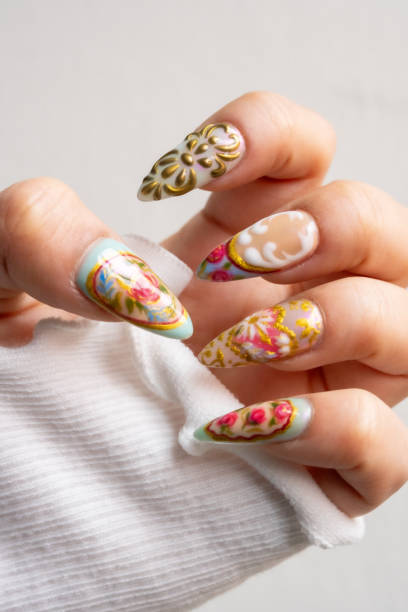 istock Colorful Nail Art Design on a Light-Skinned Female Hand 2202094271