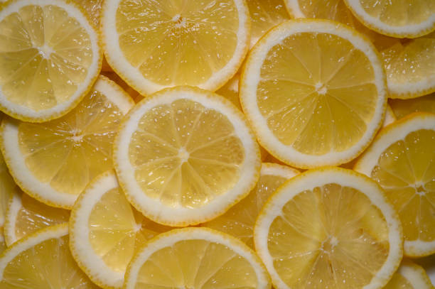 istock Bright yellow lemon slices arranged beautifully for decoration or culinary use in a vibrant kitchen setting 2202094297