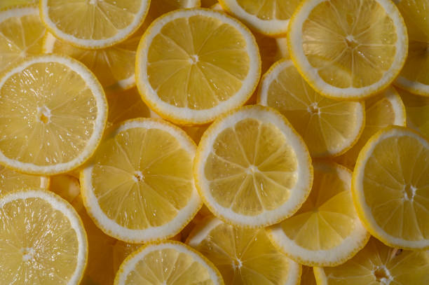 istock Fresh lemon slices create a vibrant yellow canvas perfect for summer drinks and refreshing dishes 2202094300