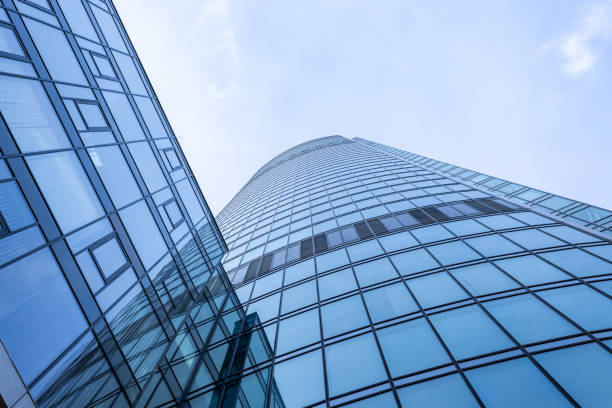 istock bottom up view of modern glass skyscraper 2202097265