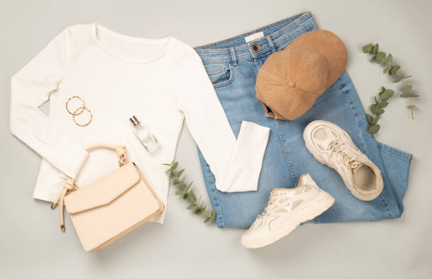Flat lay with women's trendy spring outfit on gray background,, top view