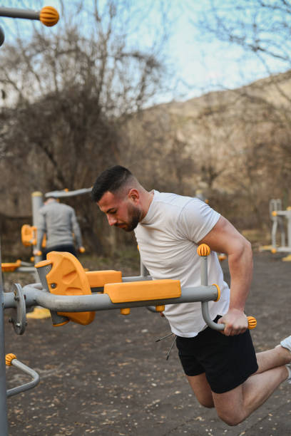 istock Handsome Male Finishing Workout With Triceps Dips Looking Strong and Motivated 2202101152