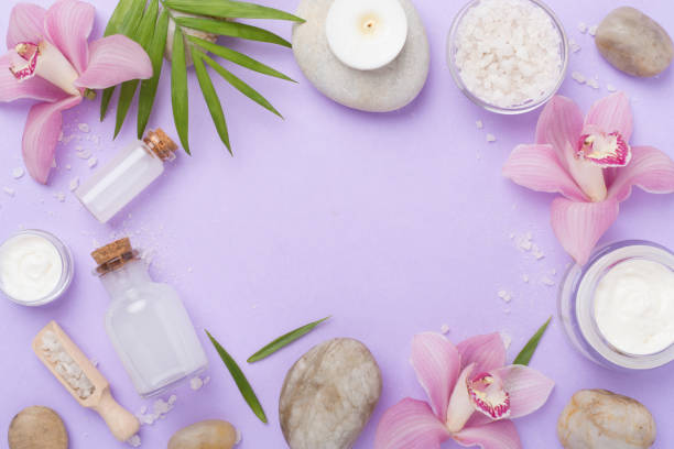 istock Composition with orchids, spa products on color background, top view 2202101327